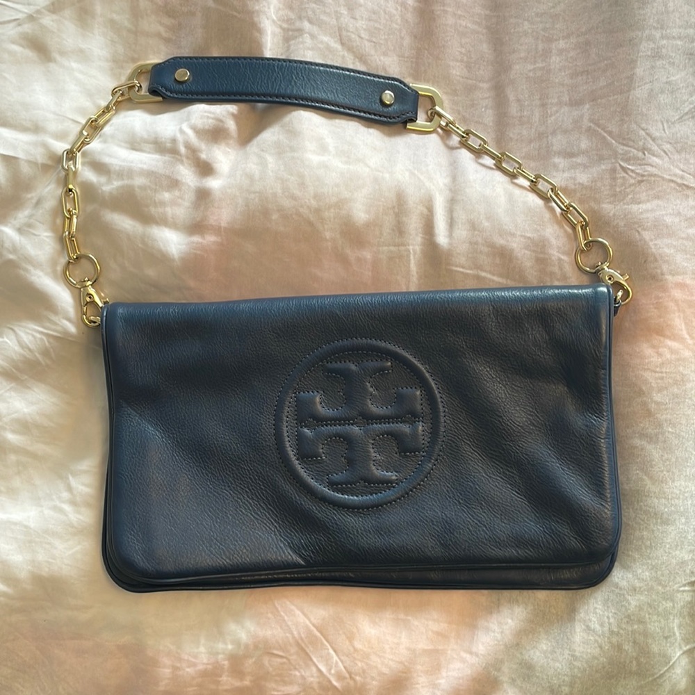 Navy blue with gold chain Tory Burch clutch. Detachable chain strap. Leather